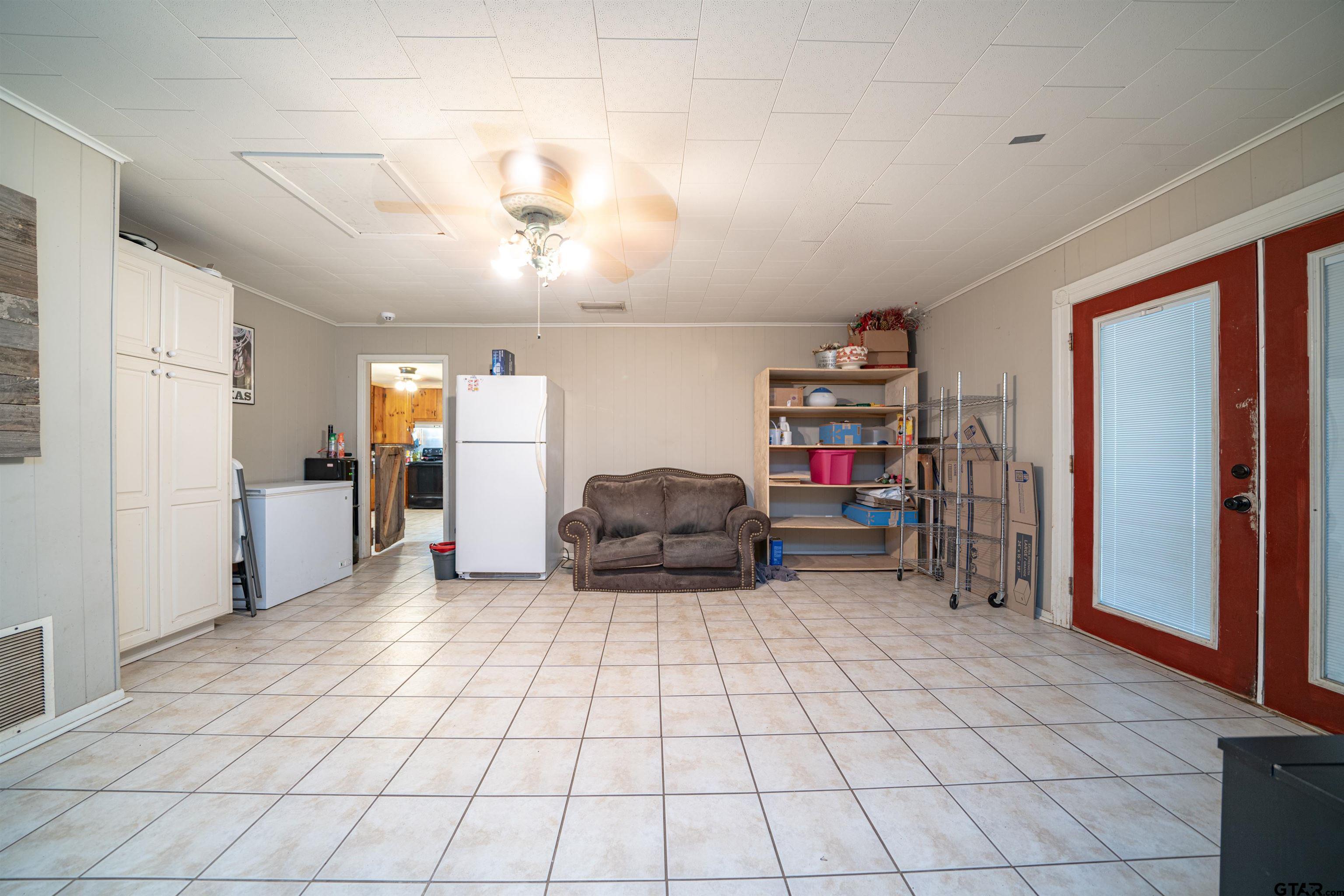 206 Summit Drive Gilmer, TX 75644 - Photo 8 of 24 a living room with furniture and a flat screen tv