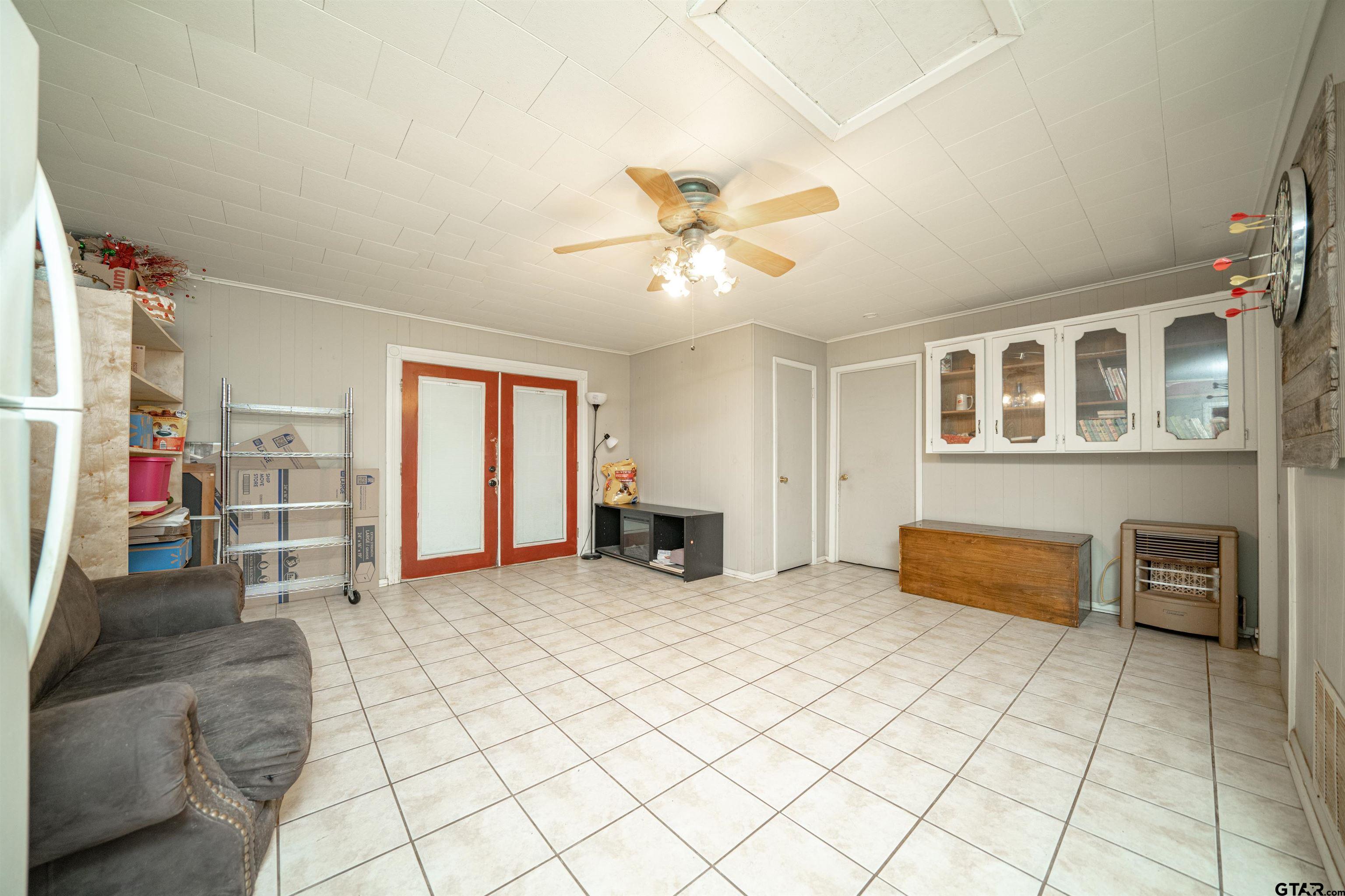 206 Summit Drive Gilmer, TX 75644 - Photo 9 of 24 a bedroom with furniture and a chandelier