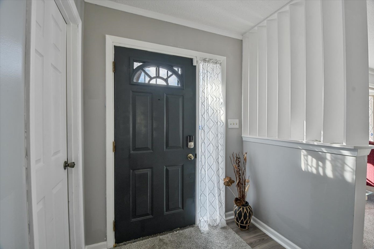 275 Alexander Drive Rantoul, IL 61866 - Photo 12 of 24 a view of an entryway with wooden floor