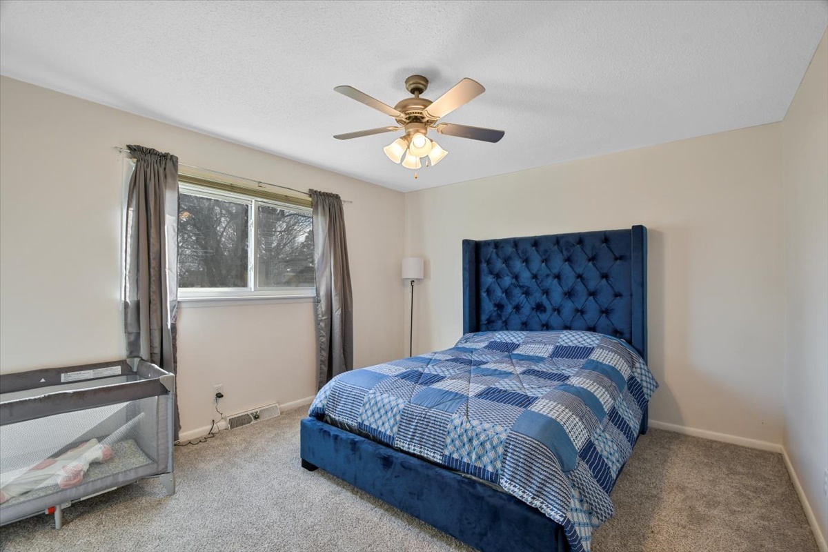 275 Alexander Drive Rantoul, IL 61866 - Photo 7 of 24 a bedroom with a bed and a window