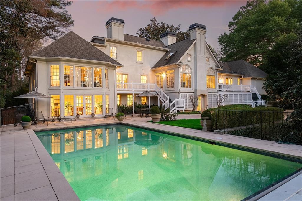 3460 Paces Valley Road Northwest Atlanta, GA 30327 - Photo 2 of 45 a view of a house with a swimming pool