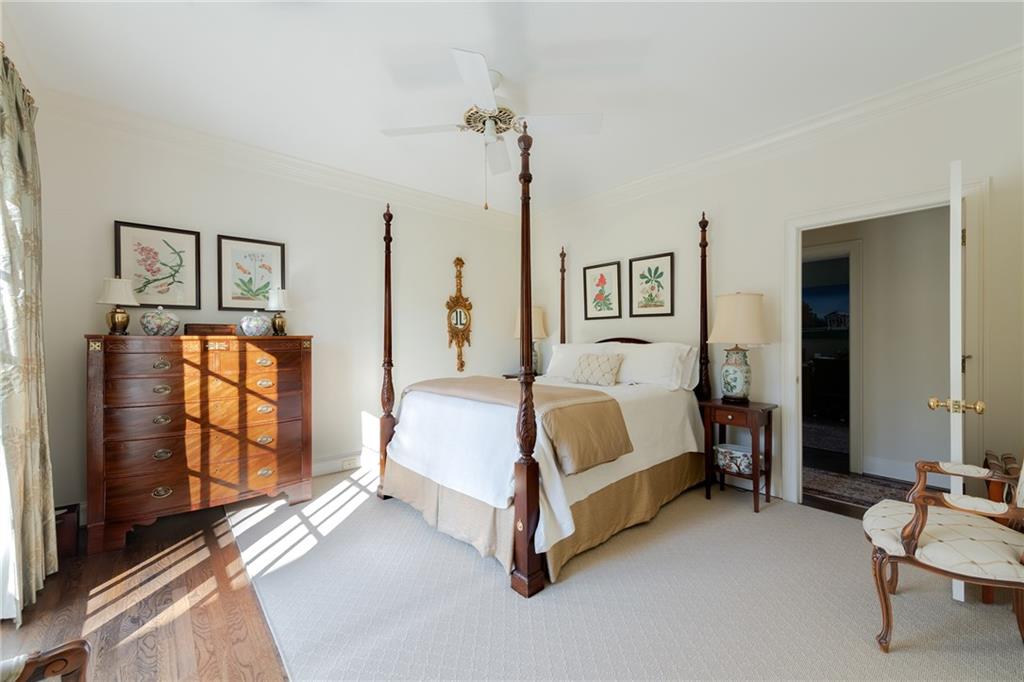 3460 Paces Valley Road Northwest Atlanta, GA 30327 - Photo 21 of 45 a spacious bedroom with a bed and a walk in closet