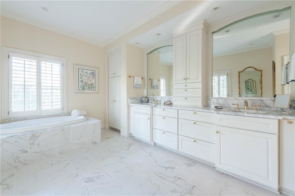 3460 Paces Valley Road Northwest Atlanta, GA 30327 - Photo 25 of 45 a spacious bathroom with a granite countertop sink mirror and a bathtub