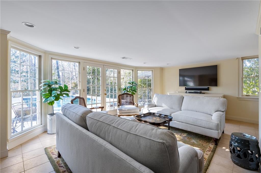 3460 Paces Valley Road Northwest Atlanta, GA 30327 - Photo 31 of 45 a living room with furniture and a flat screen tv