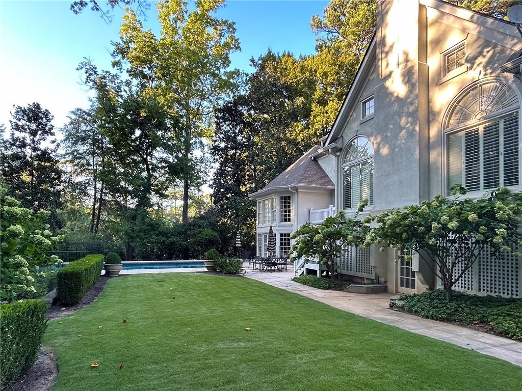 3460 Paces Valley Road Northwest Atlanta, GA 30327 - Photo 37 of 45 a house view with a garden space