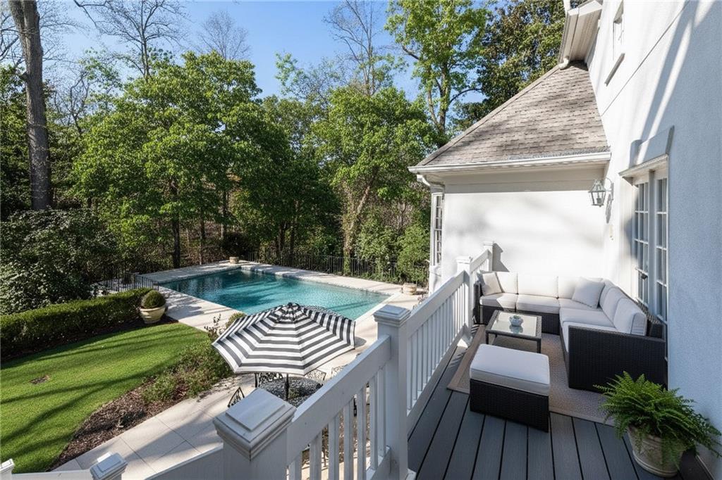 3460 Paces Valley Road Northwest Atlanta, GA 30327 - Photo 43 of 45 a view of a chairs and table on the wooden deck