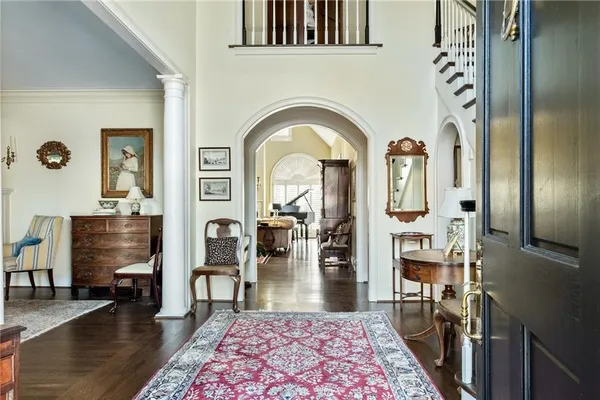 a living room with fireplace furniture and wooden floor