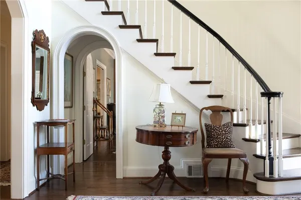 a view of entryway and hall with wooden floor