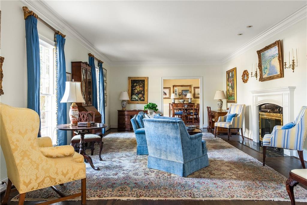 3460 Paces Valley Road Northwest Atlanta, GA 30327 - Photo 8 of 45 a living room with furniture fireplace and flat screen tv