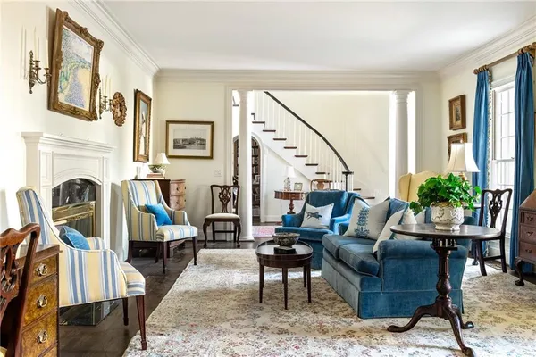 a living room with furniture or fireplace and a rug