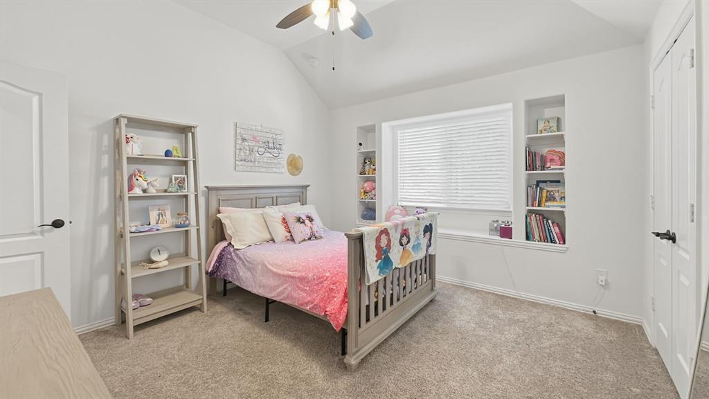 5216 Troupe Road McKinney, TX 75071 - Photo 32 of 40 Spacious room with vaulted ceiling and light-toned carpet flooring