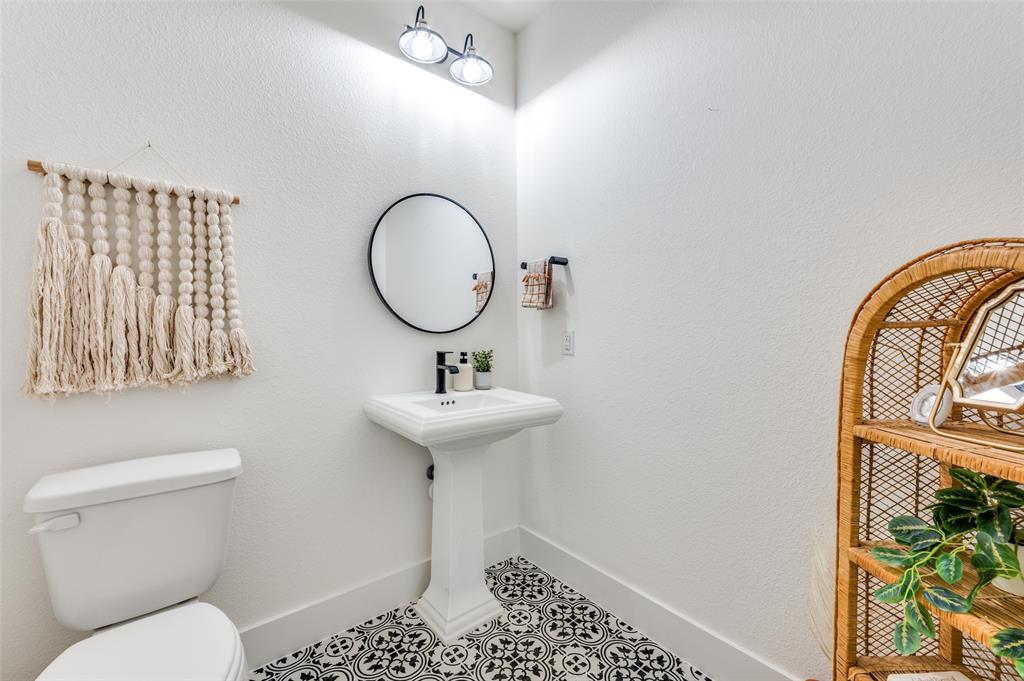660 Neale Street Prosper, TX 75078 - Photo 14 of 40 a bathroom with a sink toilet and a mirror