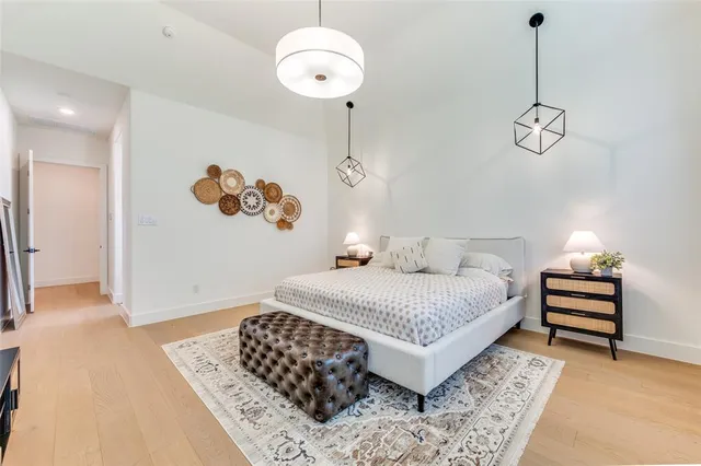 a bedroom with a bed and dresser