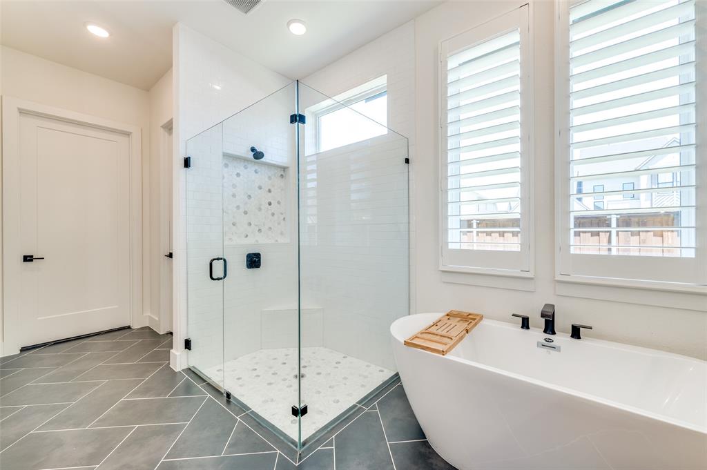 660 Neale Street Prosper, TX 75078 - Photo 18 of 40 a bathroom with a tub a sink and a shower