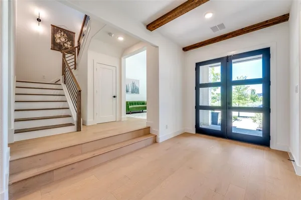 a view of empty room with stairs