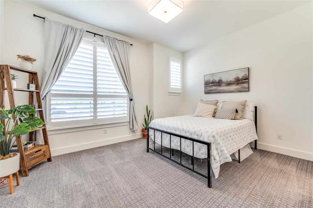 660 Neale Street Prosper, TX 75078 - Photo 22 of 40 a bedroom with a bed and a window
