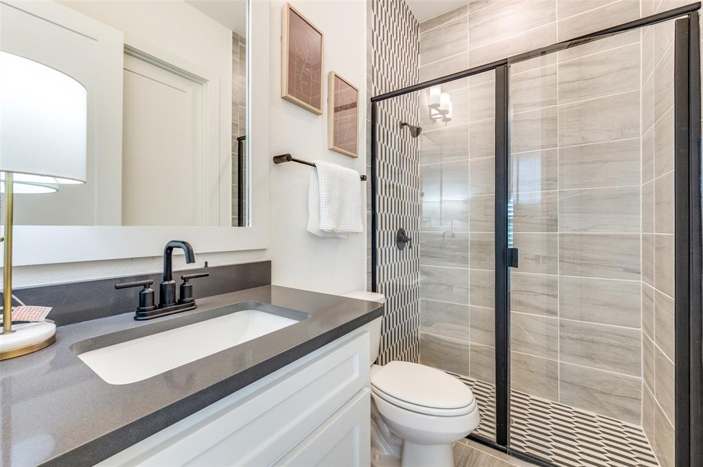 660 Neale Street Prosper, TX 75078 - Photo 23 of 40 a bathroom with a sink and a mirror