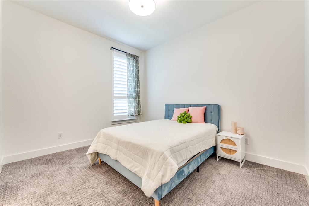 660 Neale Street Prosper, TX 75078 - Photo 25 of 40 a bedroom with a bed and window