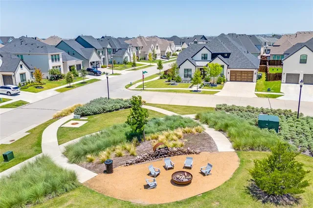 an aerial view of a house with a swimming pool
