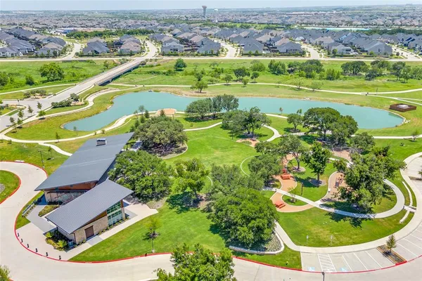 an aerial view of a house with a swimming pool yard and outdoor seating