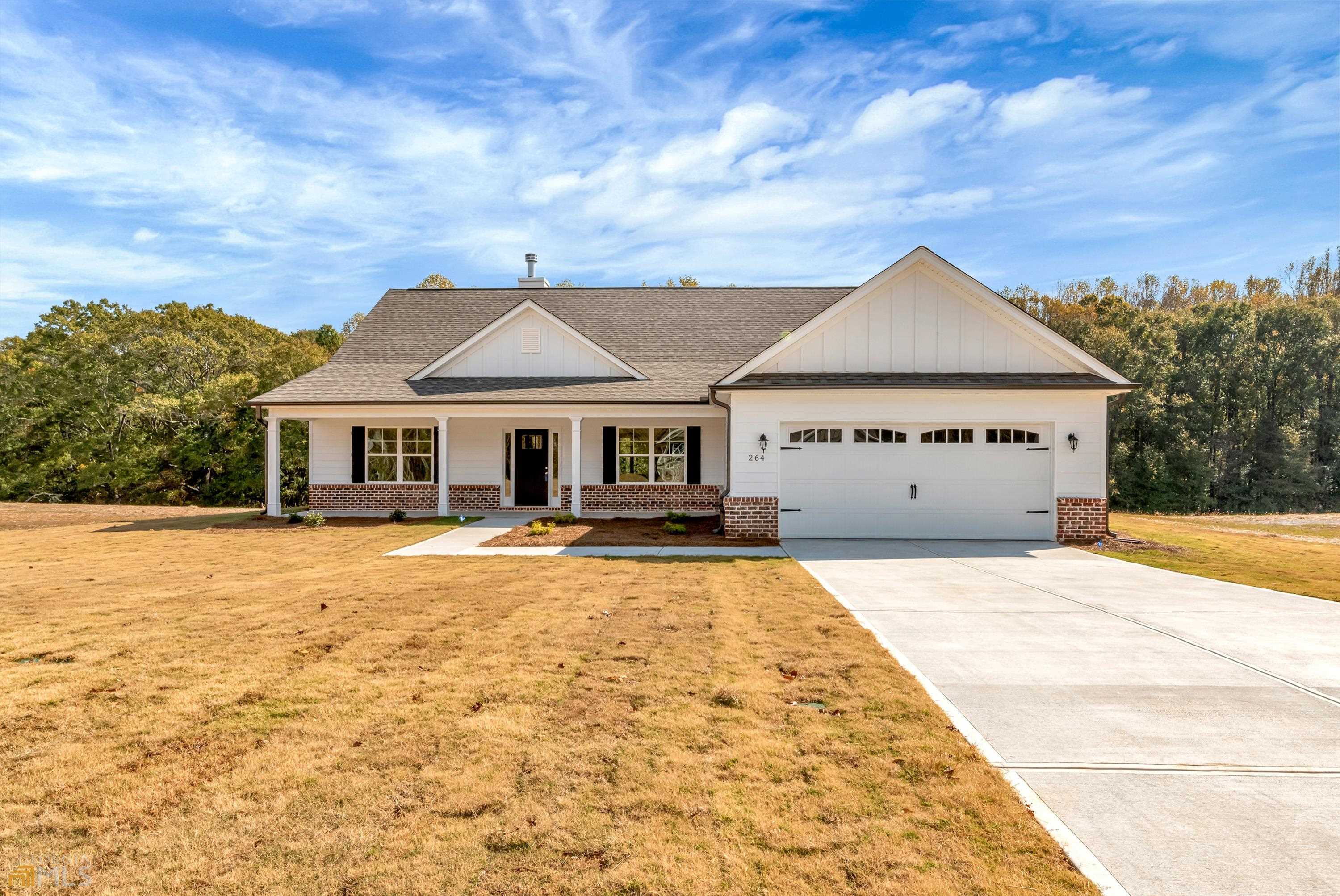 264 Finch Landing Road, Unit 7 Winder, GA 30680 - Photo 1 of 1 a front view of a house with yard and balcony