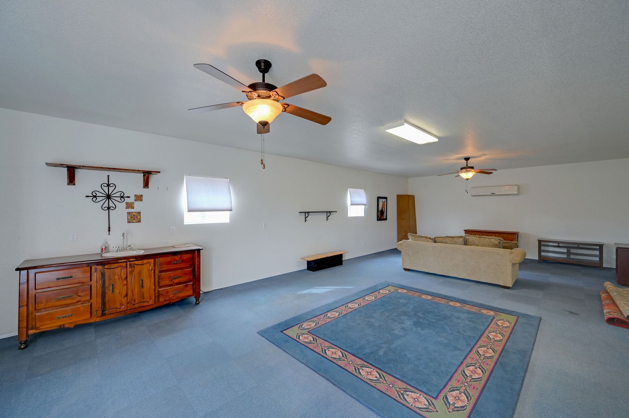 2551 Wolf Creek Ranch Road Burnet, TX 78611 - Photo 21 of 40 Living area featuring a ceiling fan