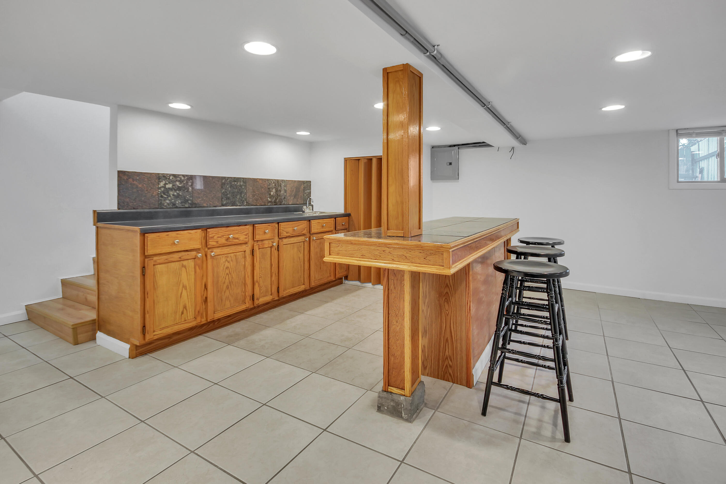 2321 Burr Street Gary, IN 46406 - Photo 12 of 29 a kitchen with stainless steel appliances granite countertop a sink and a stove