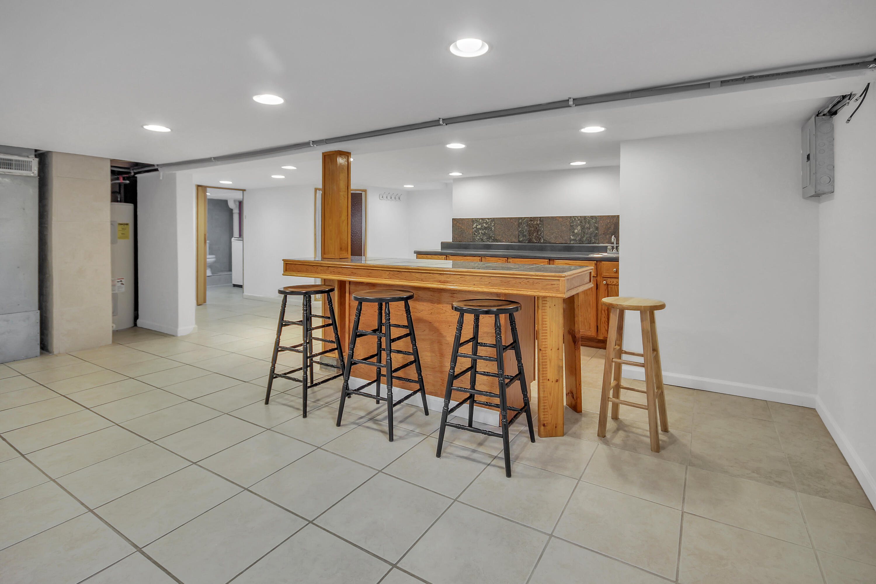 2321 Burr Street Gary, IN 46406 - Photo 15 of 29 a dining hall with stainless steel appliances a dining table and chairs