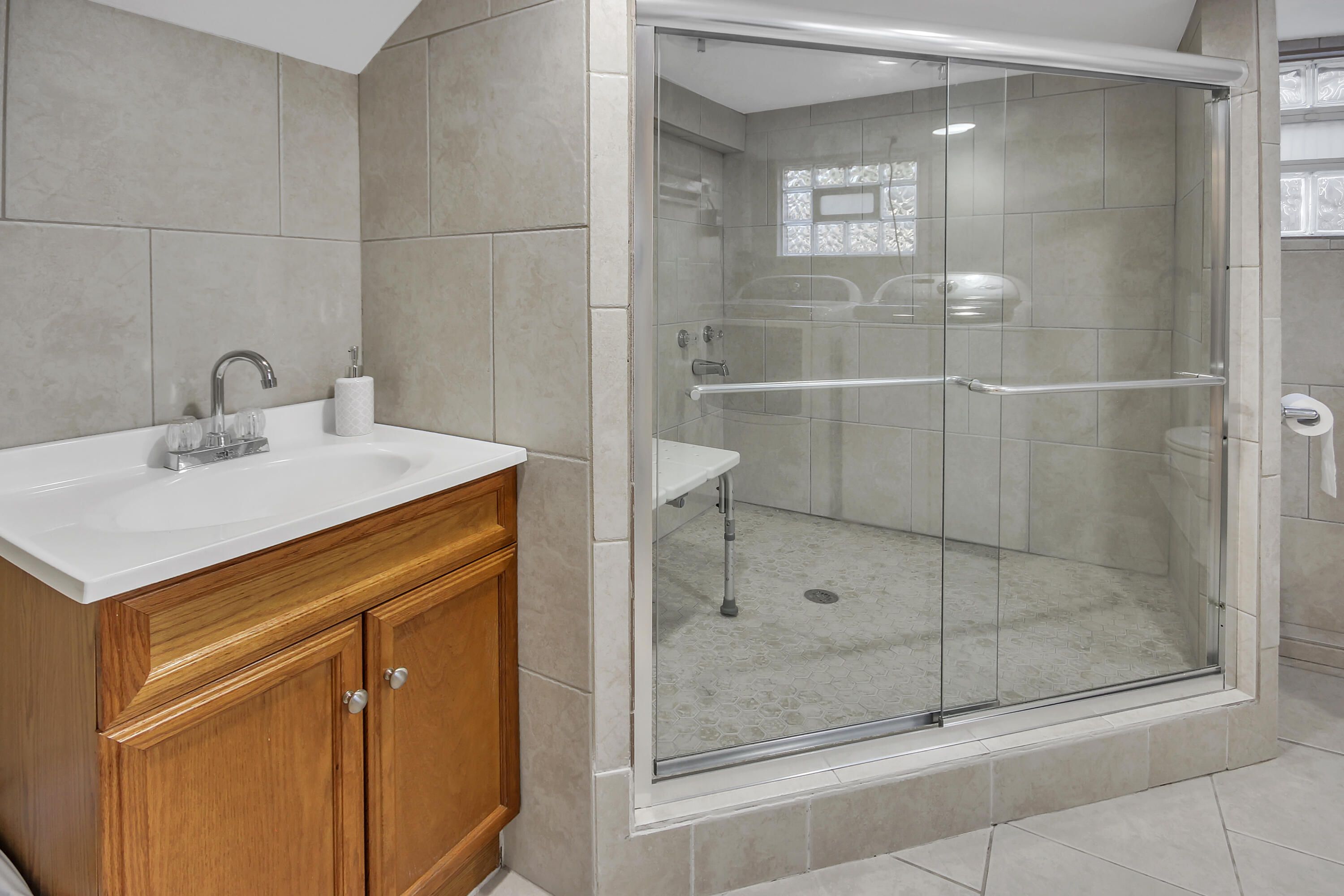 2321 Burr Street Gary, IN 46406 - Photo 17 of 29 a bathroom with a shower sink and mirror