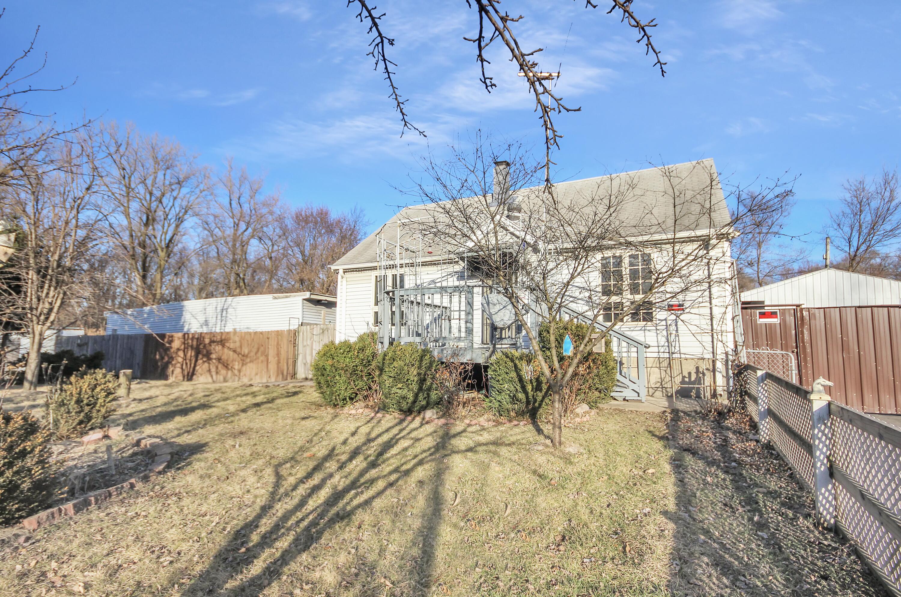2321 Burr Street Gary, IN 46406 - Photo 2 of 29 a view of a house with a snow in the yard