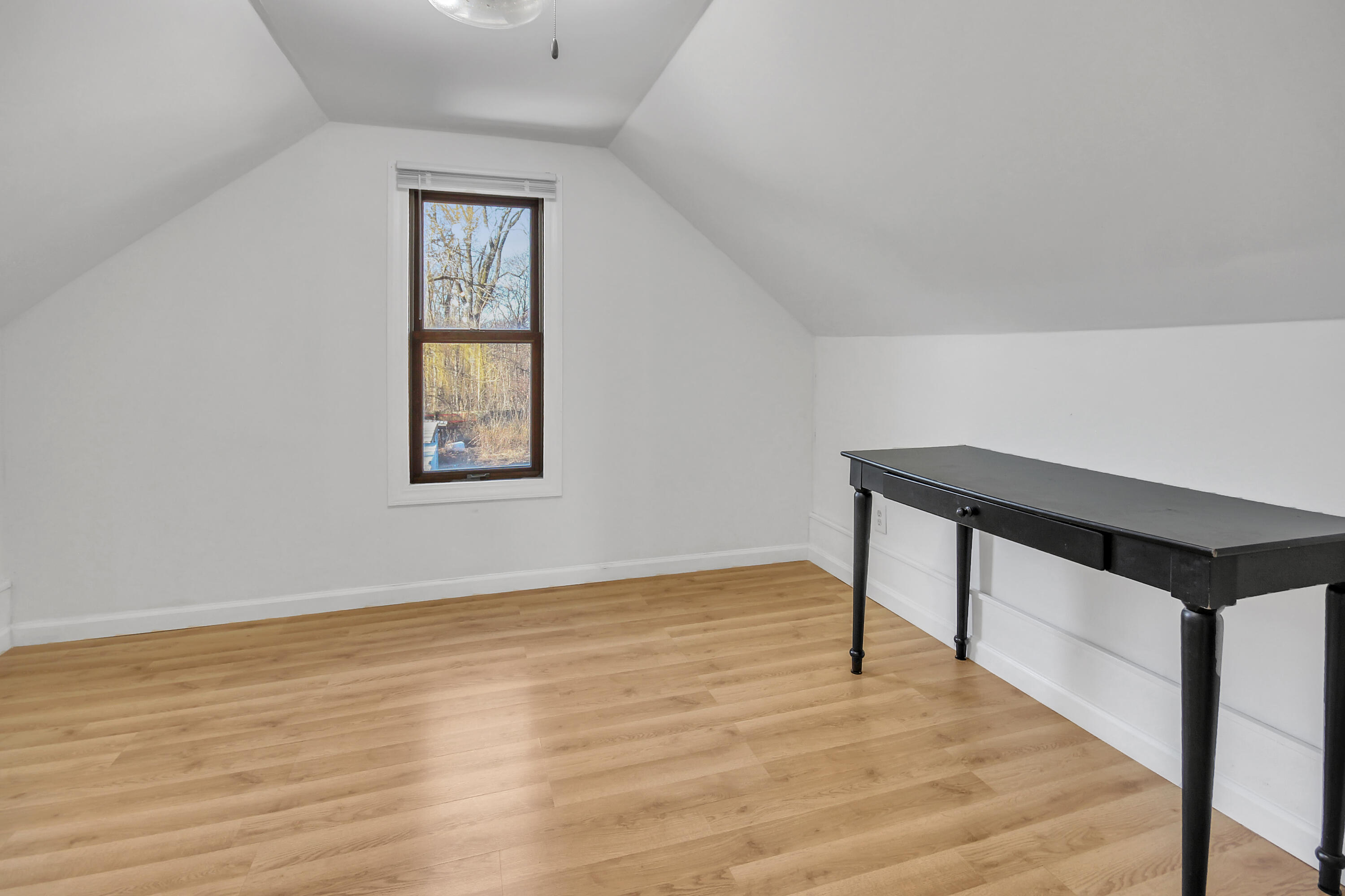 2321 Burr Street Gary, IN 46406 - Photo 21 of 29 a view of an empty room with wooden floor and a window