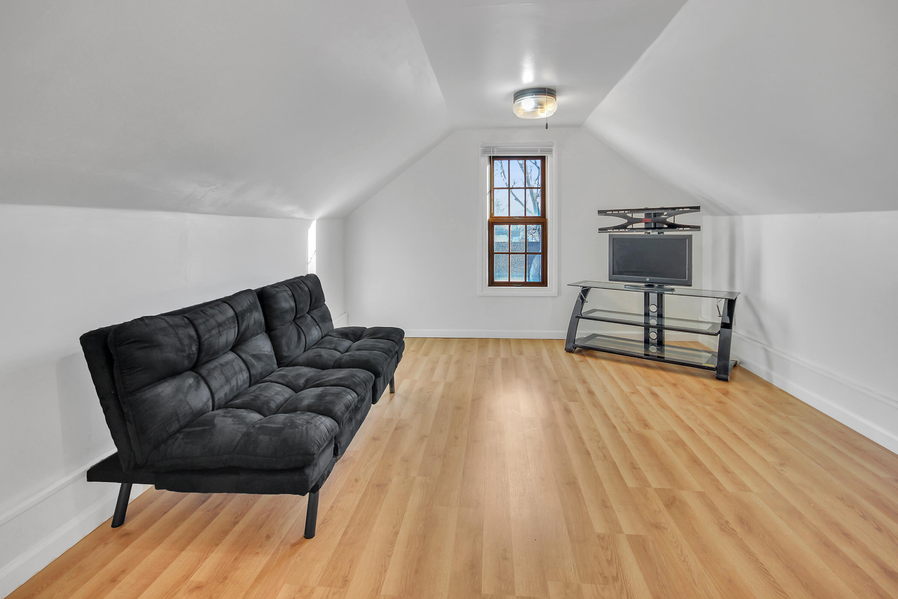 2321 Burr Street Gary, IN 46406 - Photo 23 of 29 a living room with furniture and a wooden floor
