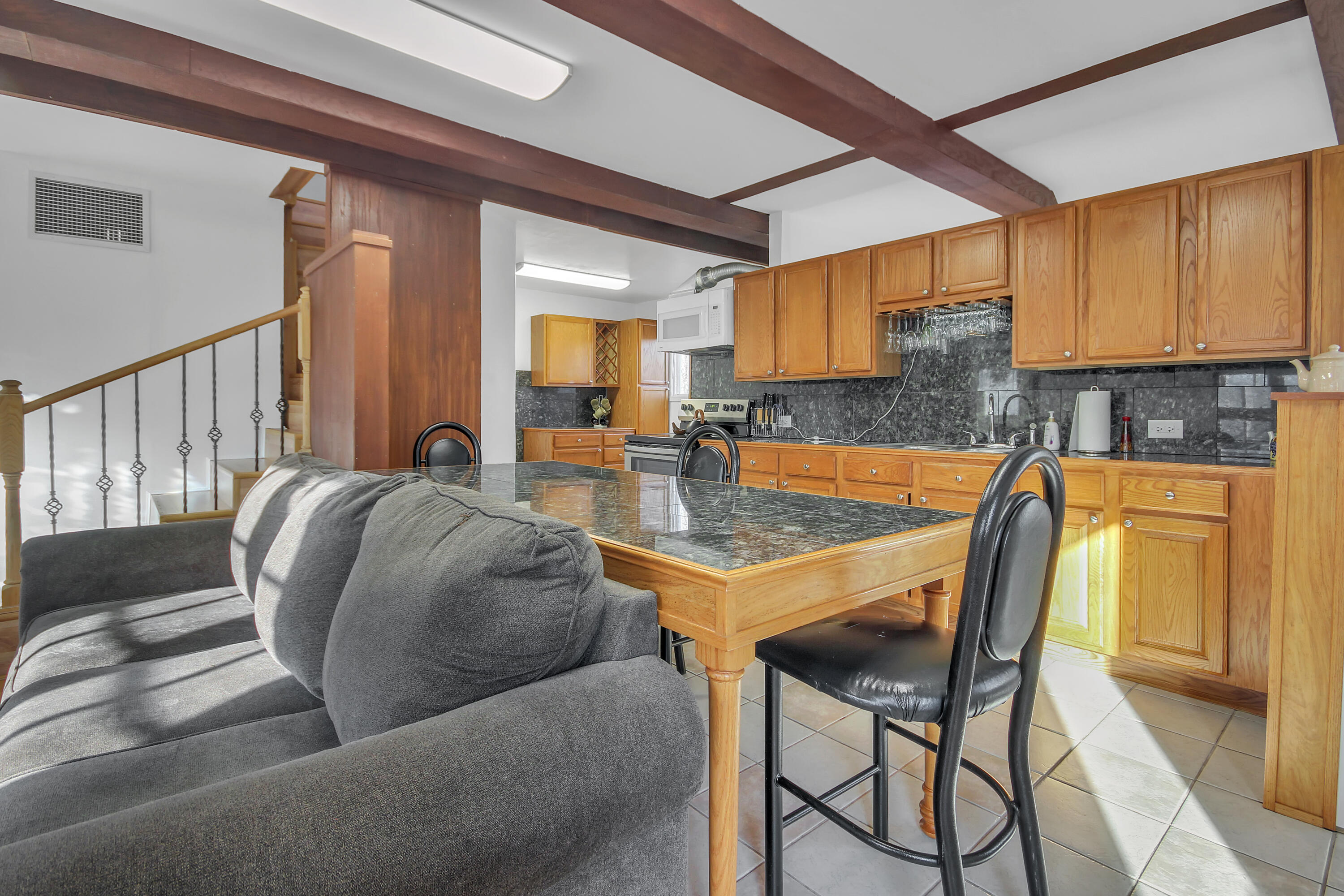 2321 Burr Street Gary, IN 46406 - Photo 7 of 29 a living room with dining table and chairs