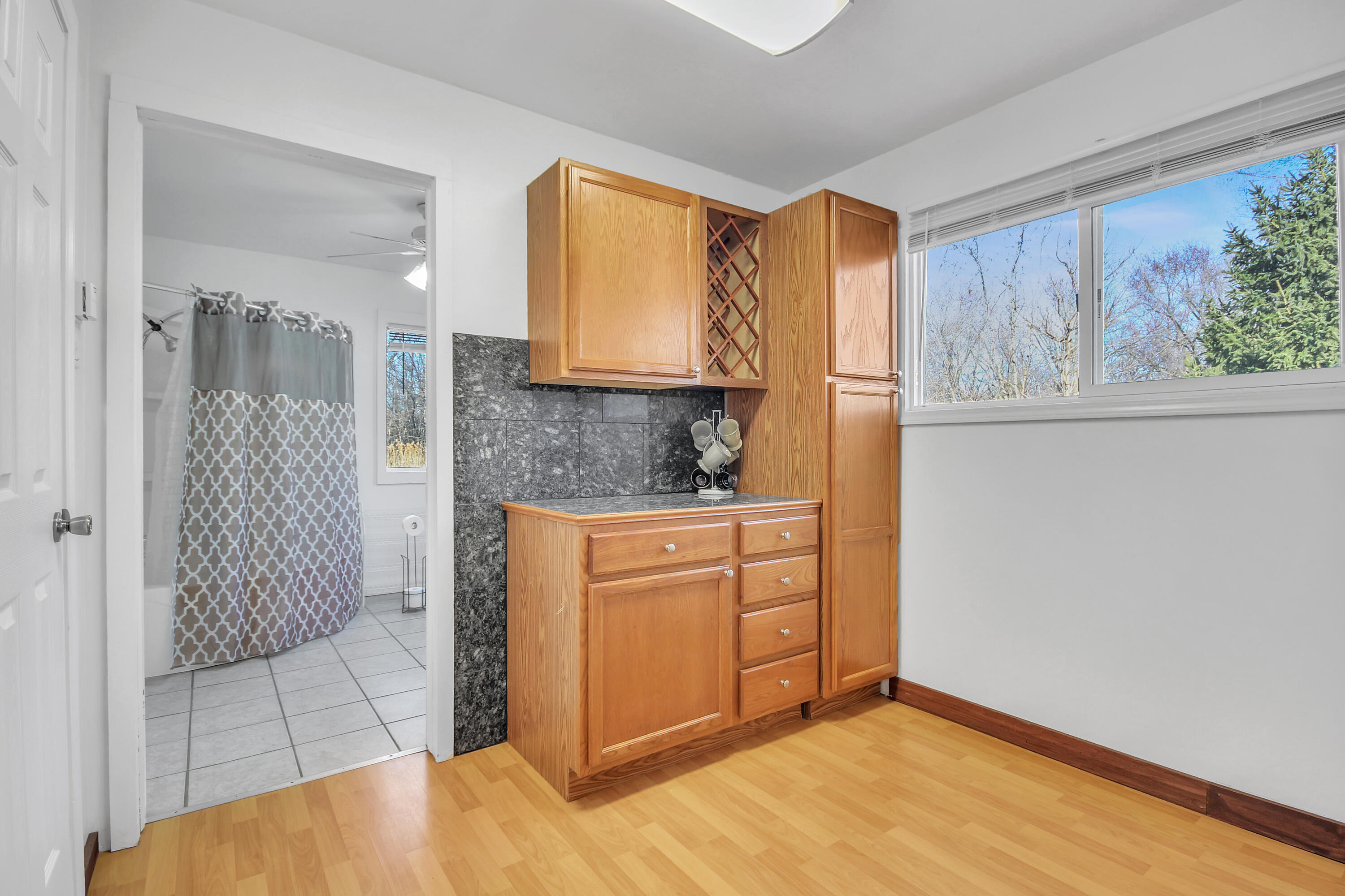 2321 Burr Street Gary, IN 46406 - Photo 8 of 29 a bathroom with a sink a mirror and a shower