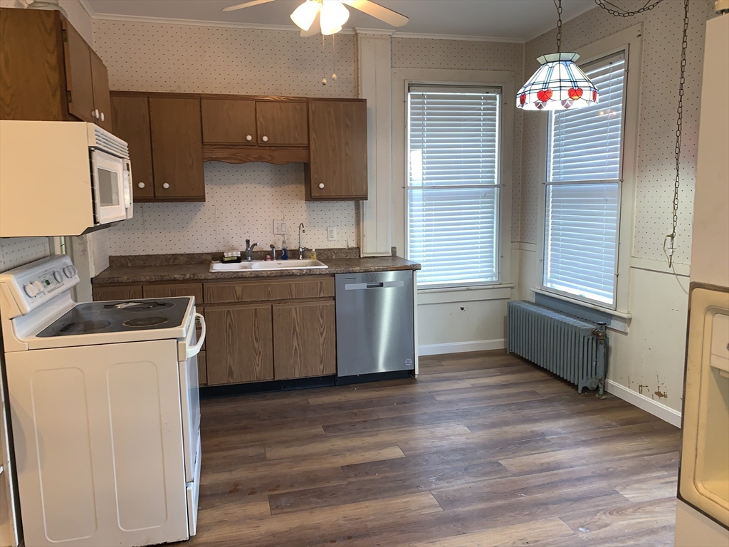 72 Green Street Athol, MA 01331 - Photo 12 of 36 a kitchen with stainless steel appliances granite countertop a sink a stove and a wooden floors