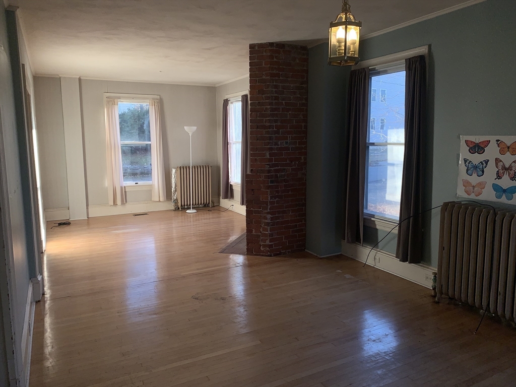 72 Green Street Athol, MA 01331 - Photo 9 of 36 an empty room with wooden floor and windows