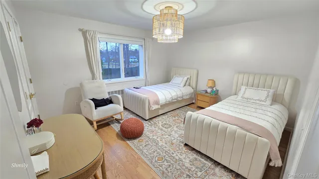 a bedroom with furniture and a window