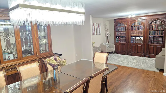 a backyard of a house with lots of green space and fountain