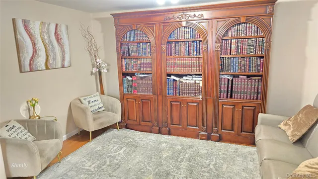 a bedroom with furniture and a window