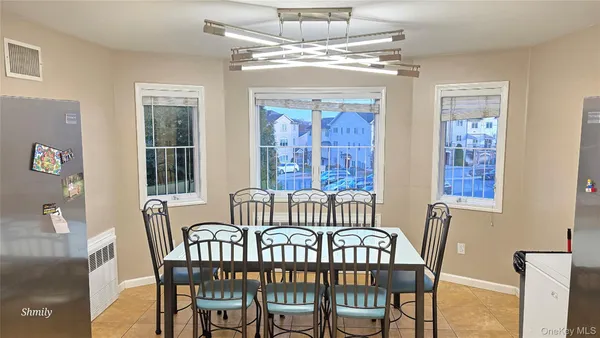 a view of a dining room with furniture window and outside view