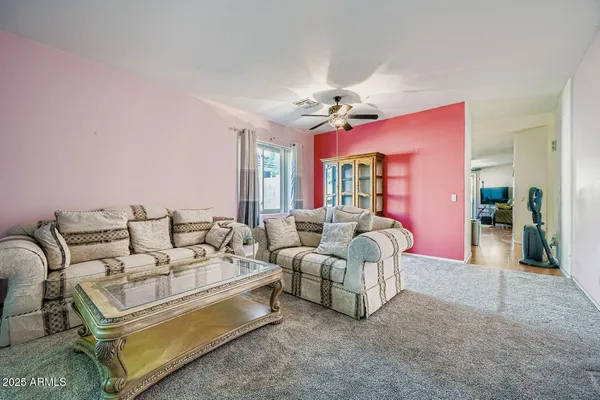 a living room with furniture and a window