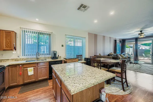 a kitchen with a stove sink and refrigerator