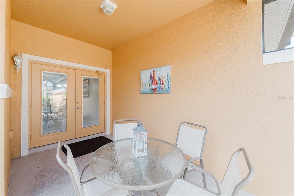 8961 Majesty Palm Road Kissimmee, FL 34747 - Photo 17 of 40 a living room with furniture and a table