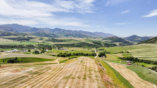 5588 East Glendale Road Preston, ID 83263 - Photo 9 of 11 Expansive rural landscape featuring rolling hills and distant mountains