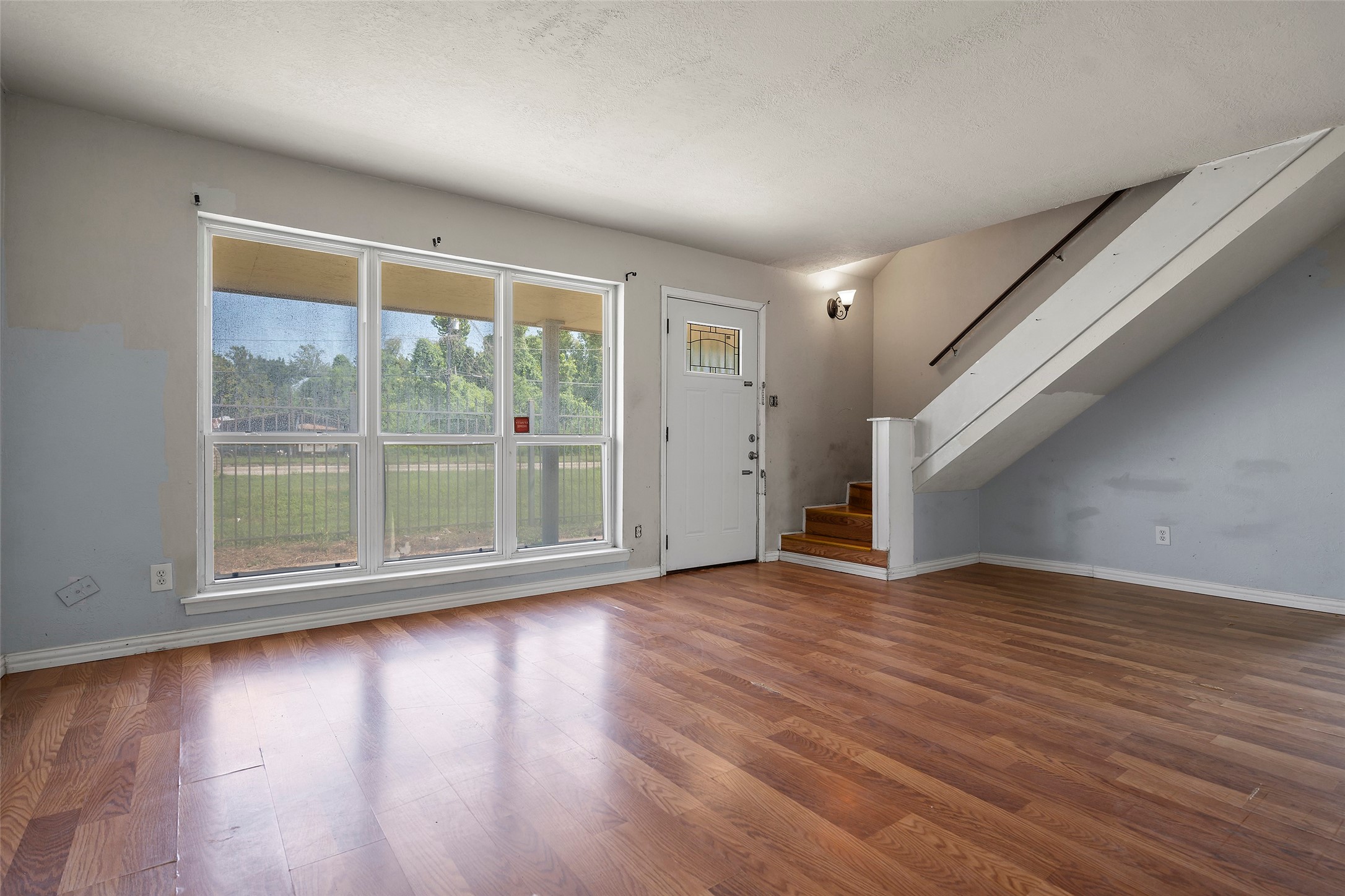 822 Aldine Mail Rte Road Houston, TX 77037 - Photo 24 of 44 a view of empty room with wooden floor and fan