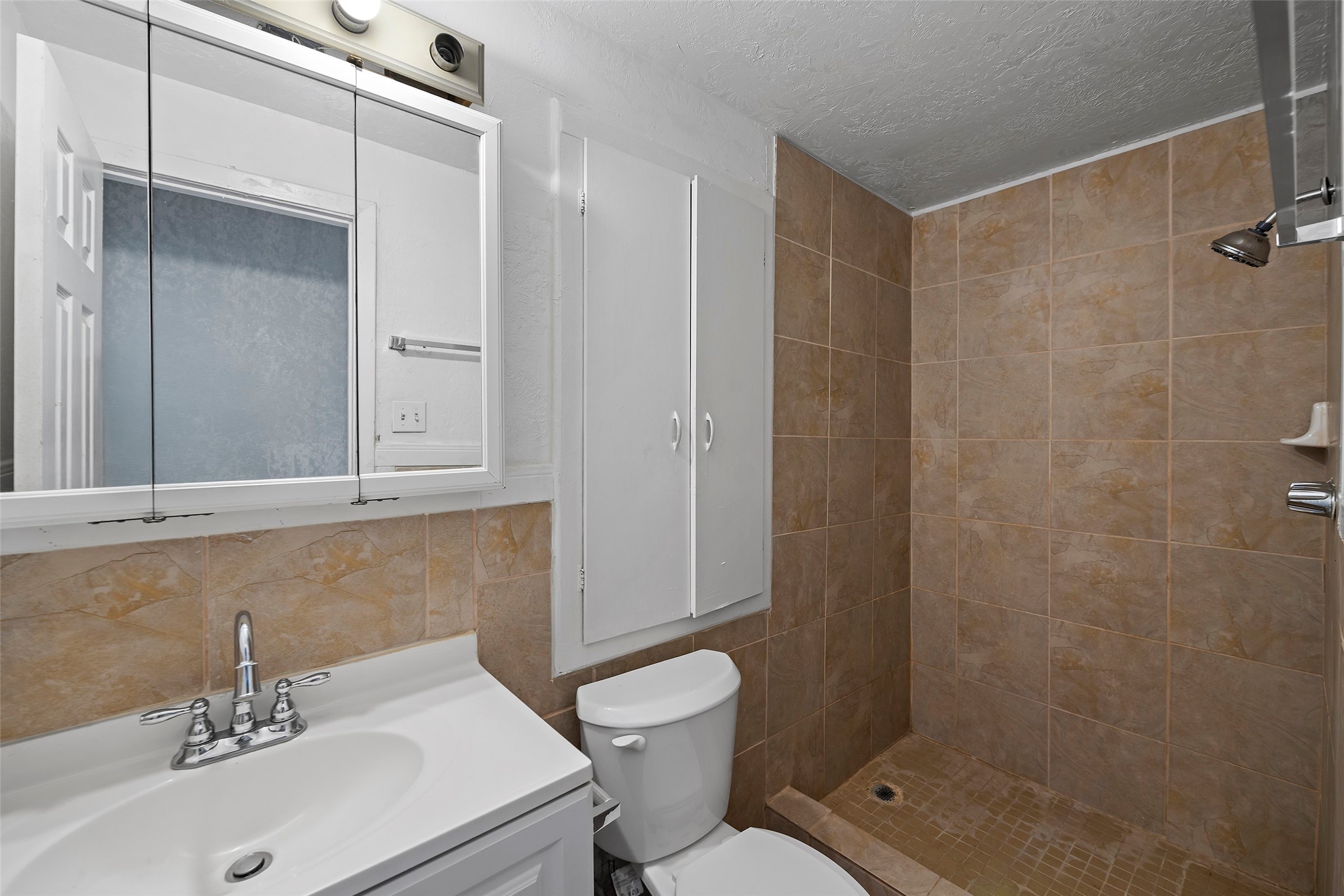 822 Aldine Mail Rte Road Houston, TX 77037 - Photo 42 of 44 a bathroom with a sink toilet and shower