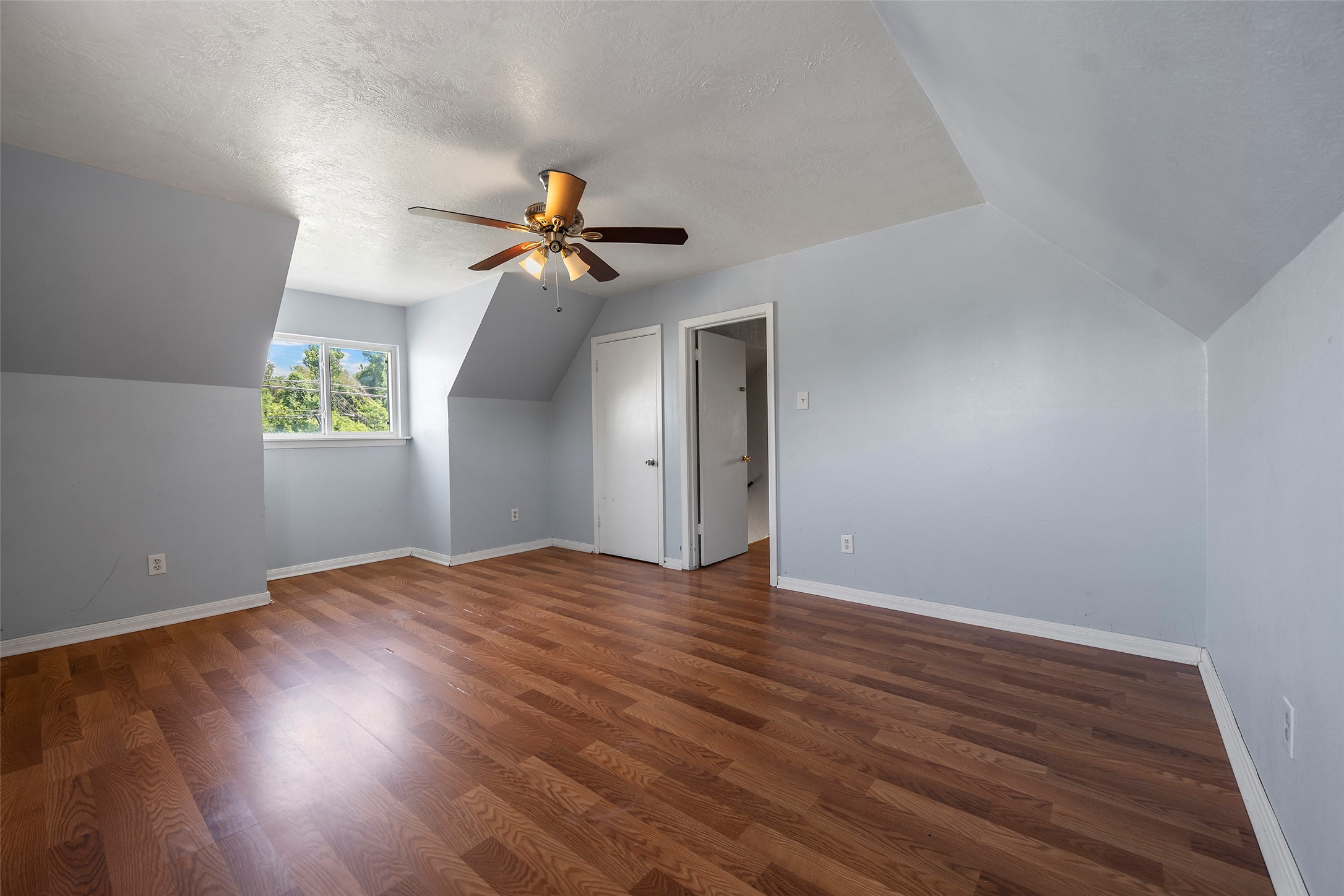 822 Aldine Mail Rte Road Houston, TX 77037 - Photo 44 of 44 a view of empty room with wooden floor and fan