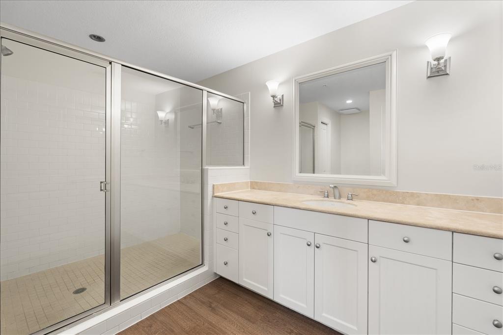 536 Bahia Beach Boulevard, Unit 431C Ruskin, FL 33570 - Photo 11 of 27 a bathroom with a double vanity sink and a mirror