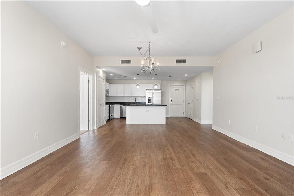 536 Bahia Beach Boulevard, Unit 431C Ruskin, FL 33570 - Photo 9 of 27 a view of a kitchen with wooden floor and a kitchen