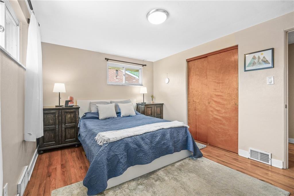 1654 Hollyrood Road Pittsburgh, PA 15227 - Photo 12 of 33 a bedroom with a bed and a table